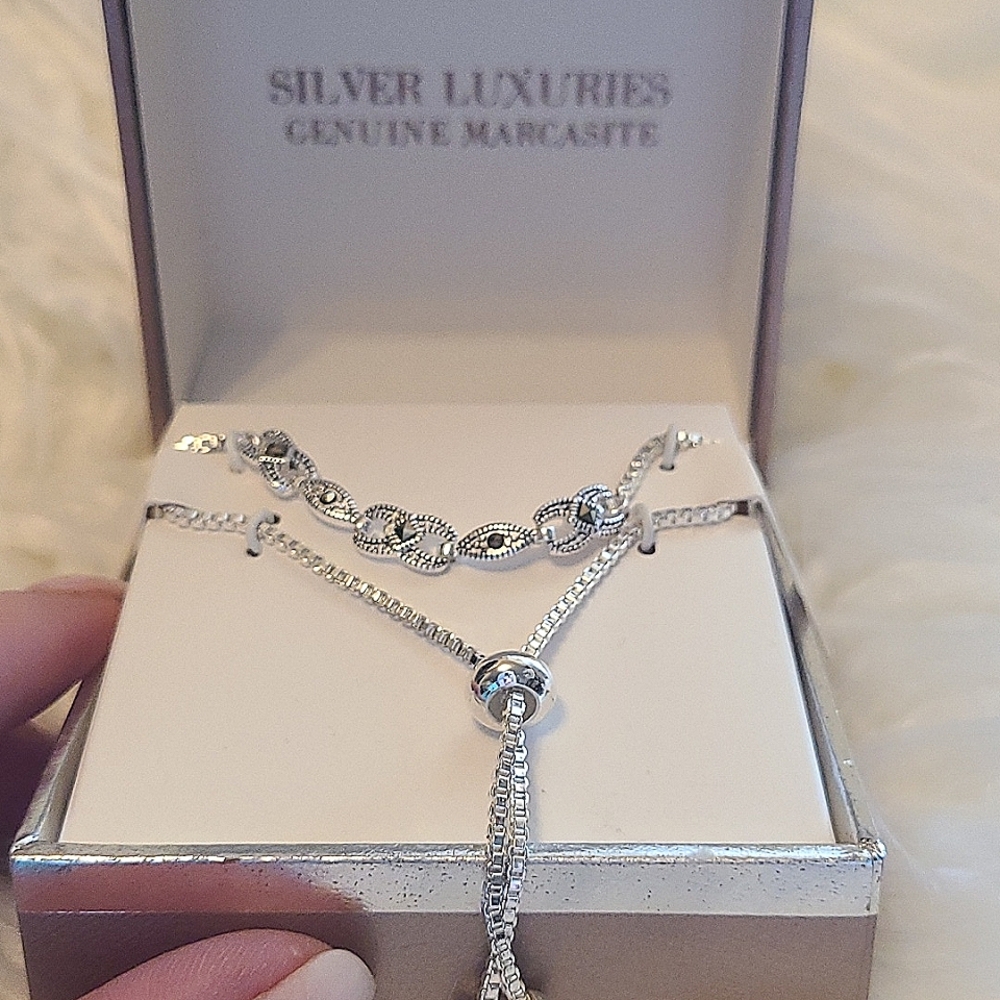 7-8" adjustable silver bracelet with marcasite, bead slide closure, & box chain.